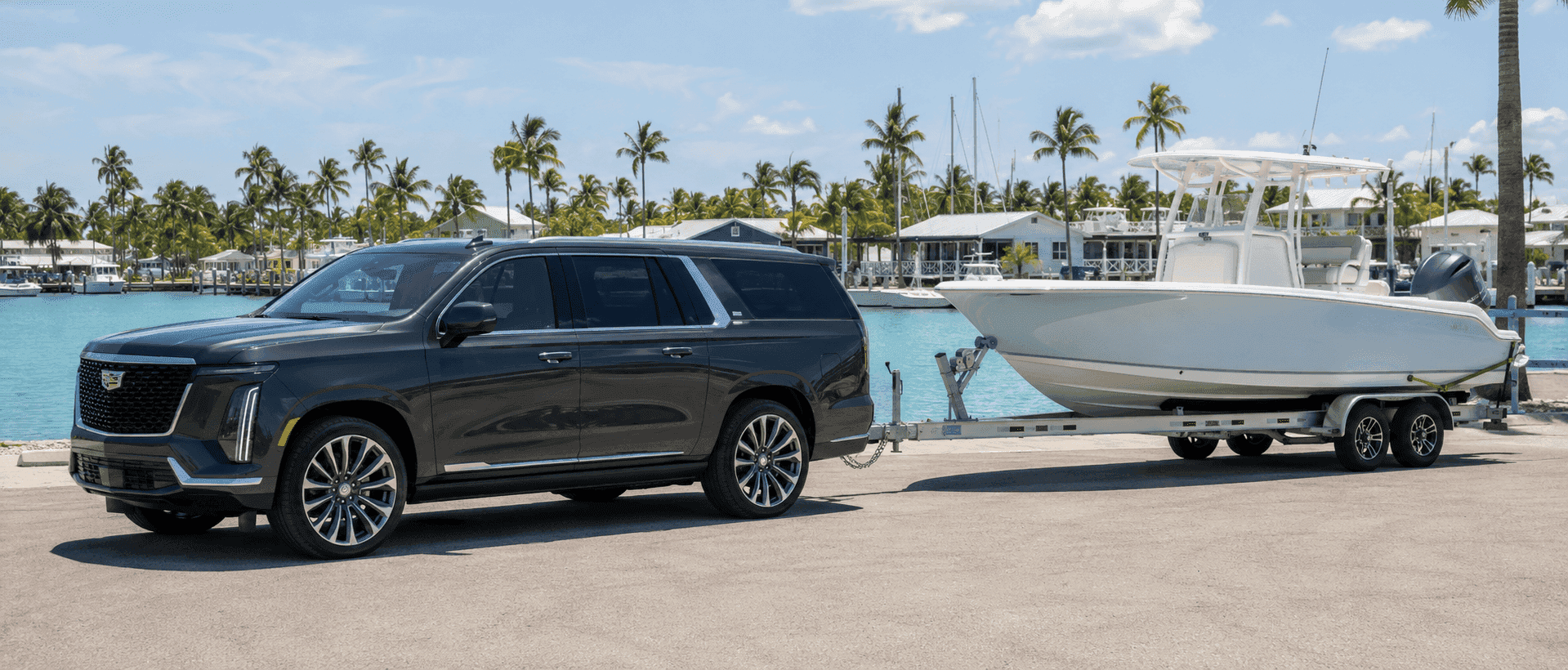 2026 Cadillac Escalade with a boat trailer parked at a Florida Keys marina