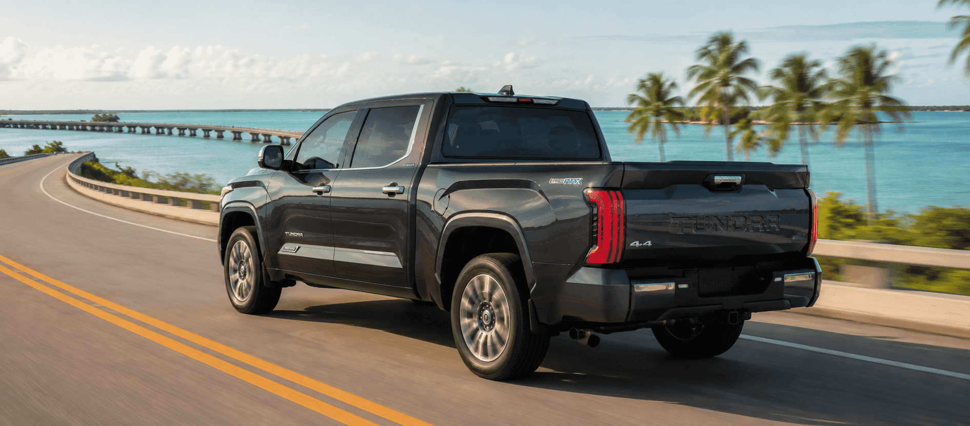 2026 Toyota Tundra towing a center-console boat near a Florida Keys marina