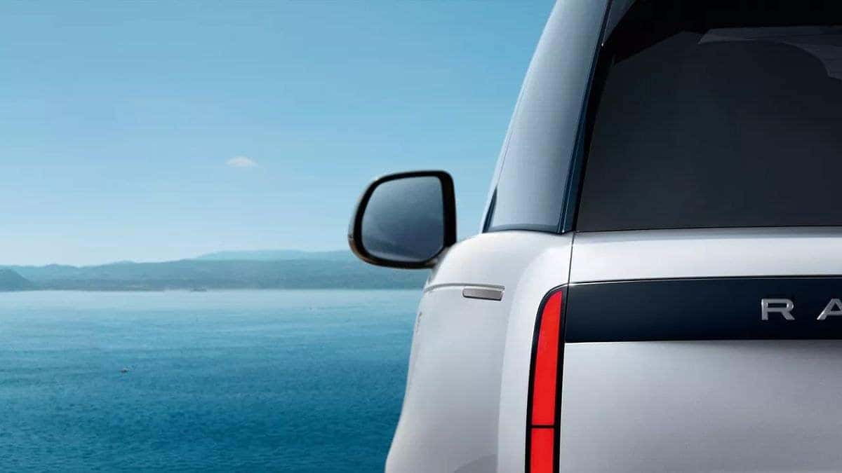 2026 Land Rover Range Rover rear quarter detail, white exterior with dark trim