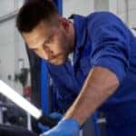 mechanic working on car
