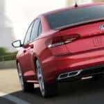 red passat driving on highway