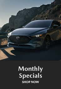 Dark Mazda sedan with title Monthly Specials 