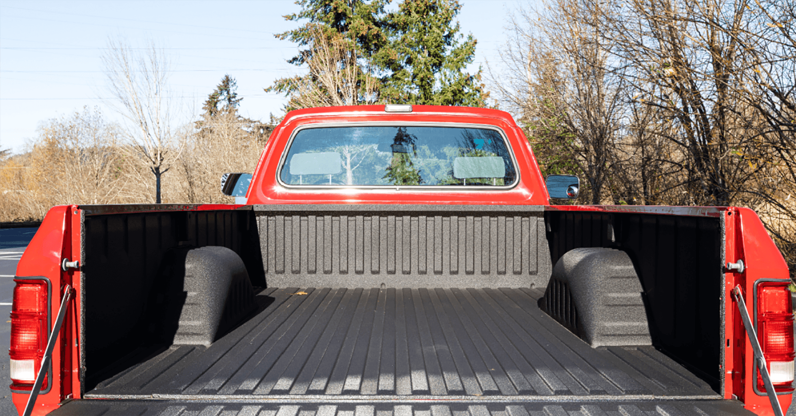bed of a red pickup truck