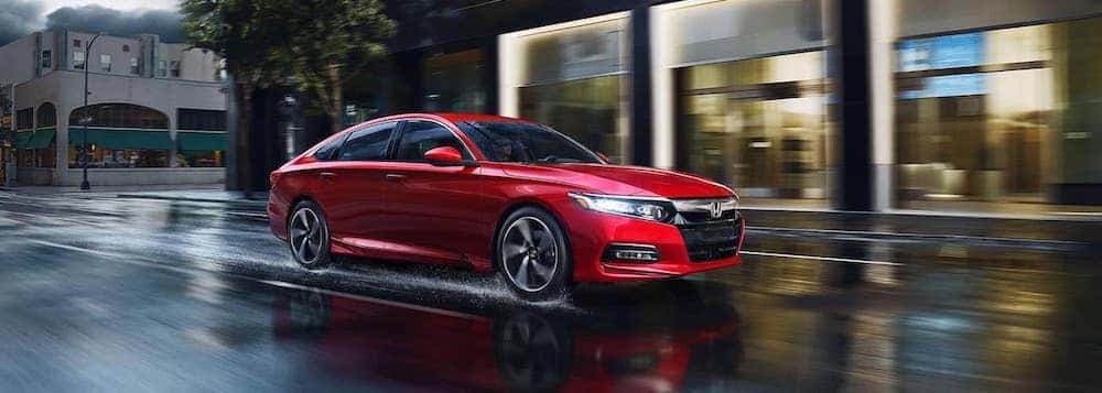 2018 honda accord red exterior driving down road in rain