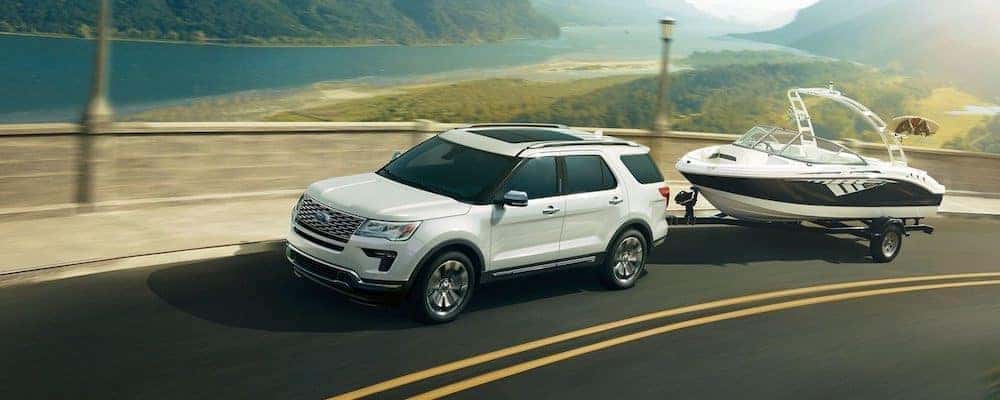 2019 ford explorer white exterior driving down road towing boat - Used Ford Explorer