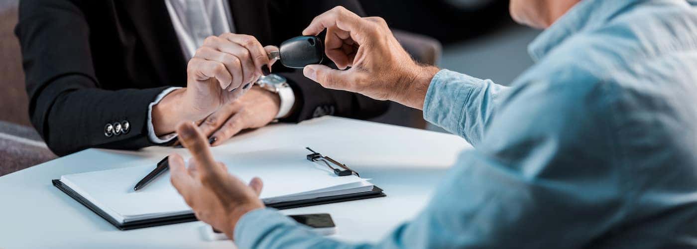 customer handing over car keys