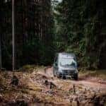 Mercedes-Benz sprinter van traveling down a trail road