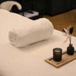 Towel and supplies on a massage table at a spa