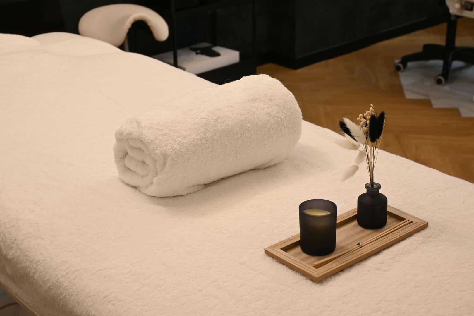 Towel and supplies on a massage table at a spa