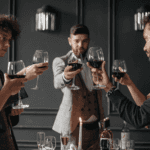4 men drinking wine in a restaraunt