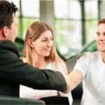 Man shaking man's hand