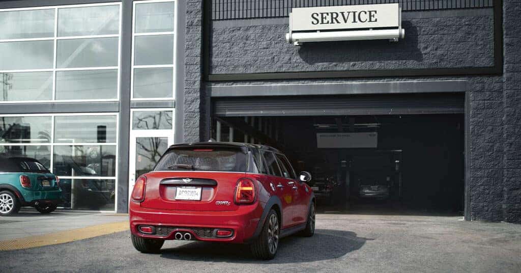 MINI Cooper going in to a service center to receive new tires