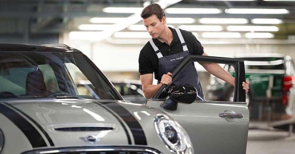 MINI service technician working on a vehicle