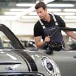 MINI service technician working on a vehicle