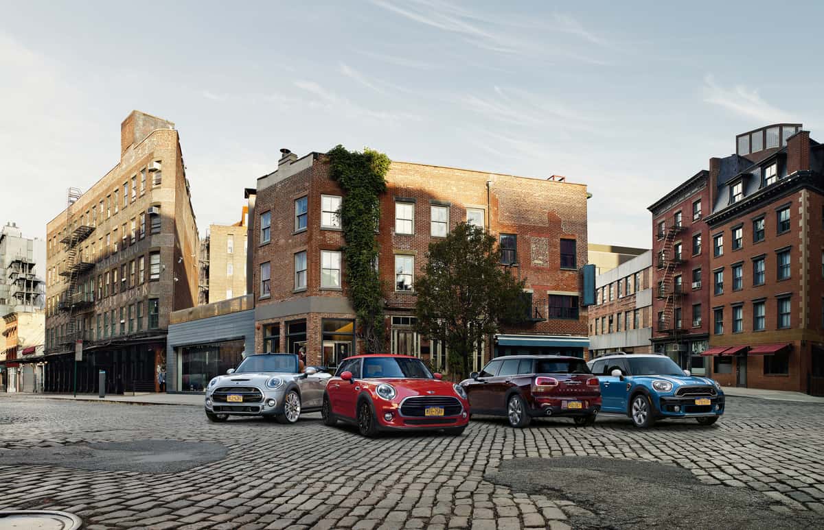 MINI Cooper Certified Pre-Owned vehicles parked in a city