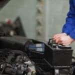 Technician replacing a MINI battery