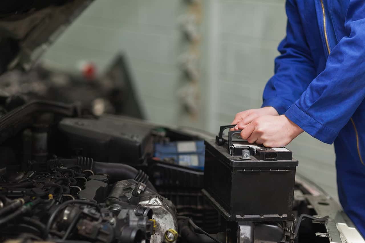 Technician replacing a MINI battery