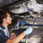 Honda Technician Inspecting Undercarriage