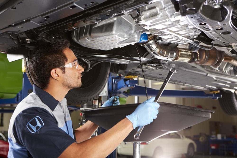 Honda Technician Inspecting Undercarriage