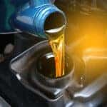 Refueling and pouring oil quality into the engine motor car Transmission and Maintenance Gear .Energy fuel concept.