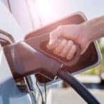 Charging a PHEV hand close-up