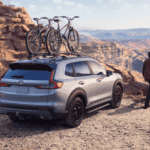 Honda CR-V Hybrid at the top of a mountain with a bike rack on it