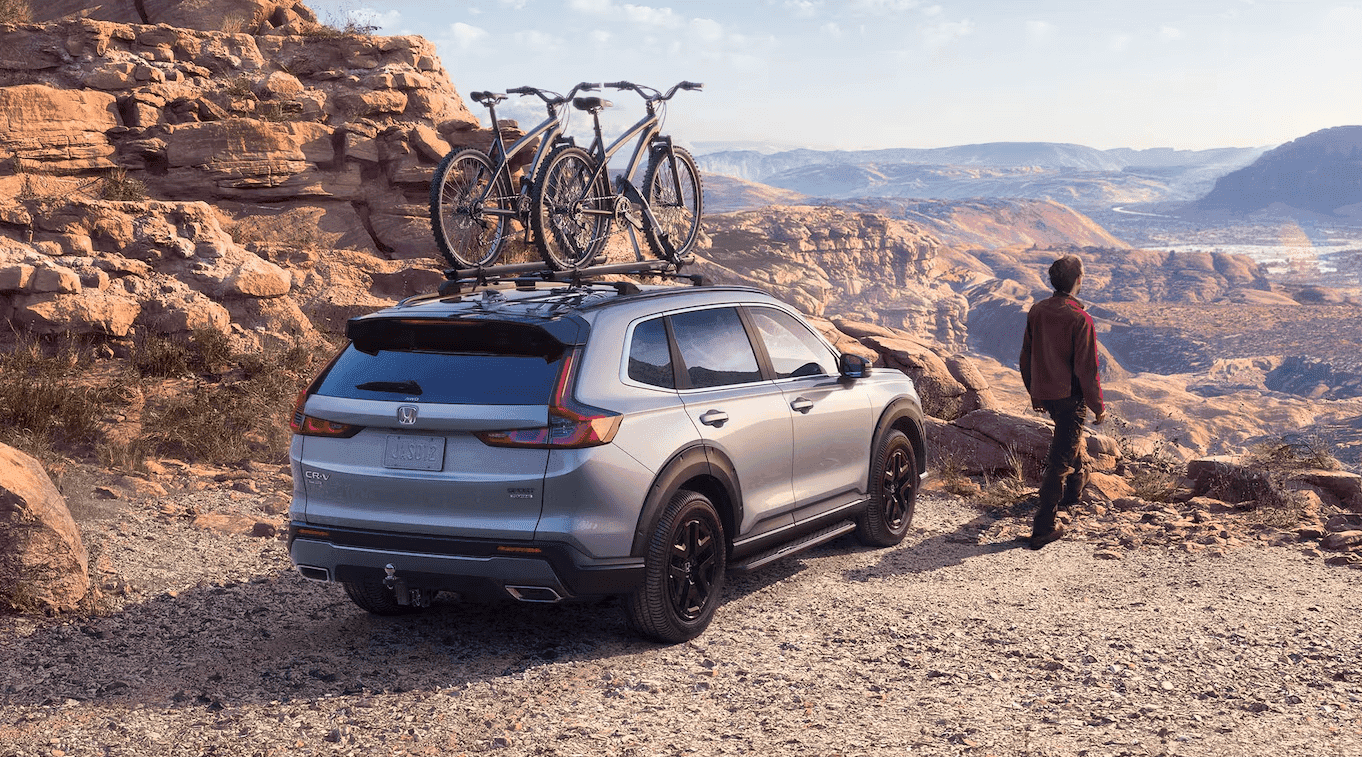 Honda CR-V Hybrid at the top of a mountain with a bike rack on it