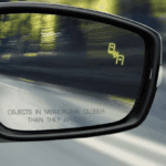Blind spot monitoring light on mirror close up