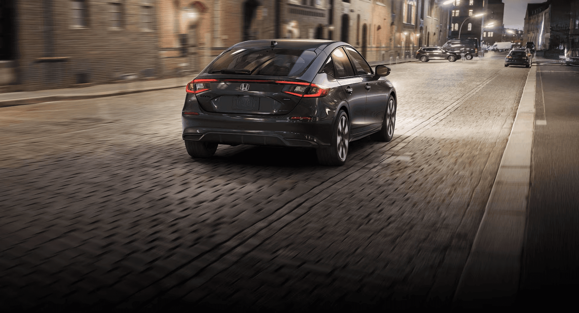 black Honda Civic Hatchback driving at night
