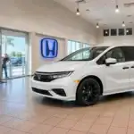 Honda Odyssey minivan on display at a Honda dealership