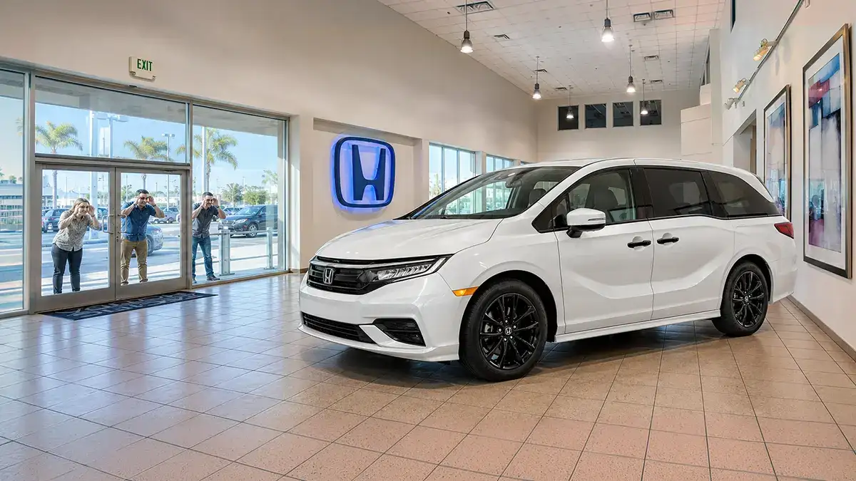 Honda Odyssey minivan on display at a Honda dealership