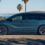 Silver 2026 Honda Odyssey minivan in a Honda showroom