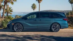 Silver 2026 Honda Odyssey minivan in a Honda showroom