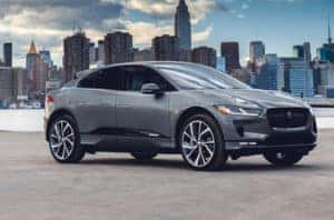 A new JAGUAR I-PACE parked outside of a city