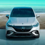 A front look of the Mercedes AMG EQE SUV parked by the beach.