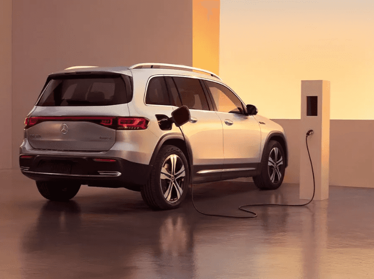 A Mercedes-Benz EQB 350 charging at an electric vehicle charging station.