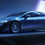 A silver Mercedes-Benz EQS 450 4MATIC AWD driving through a light tunnel.