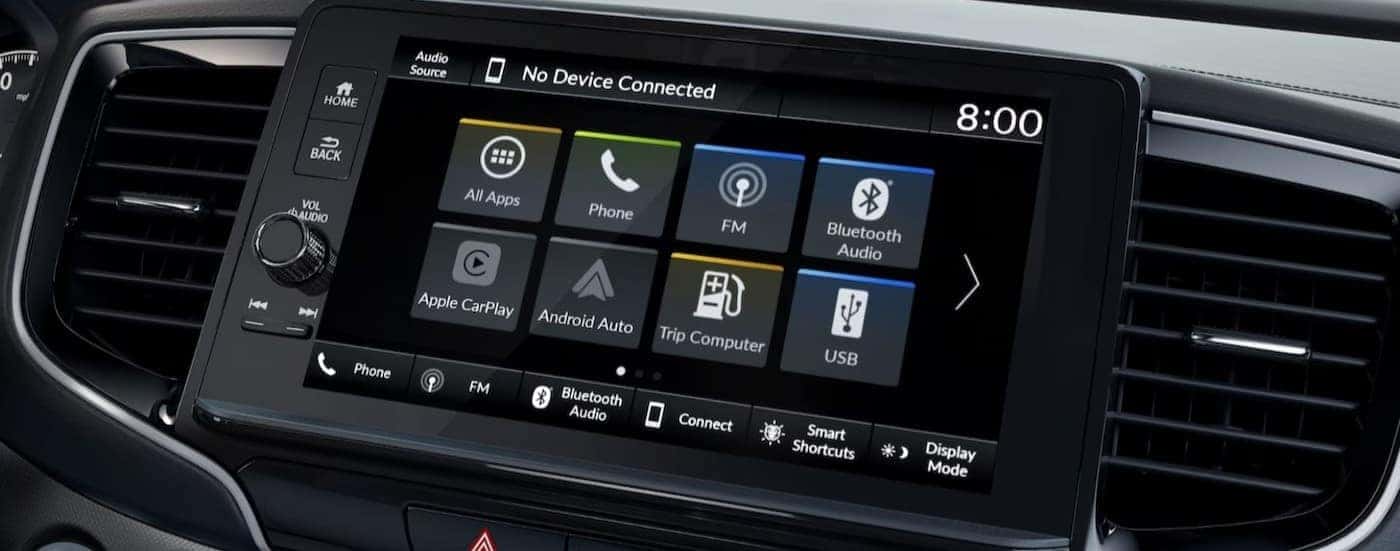A close-up of an infotainment screen is shown in a 2025 Honda Ridgeline for sale.