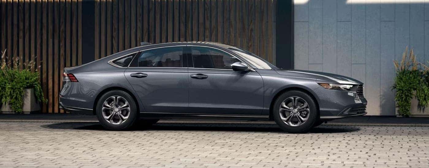 A gray 2024 Honda Accord is shown parked on a driveway.