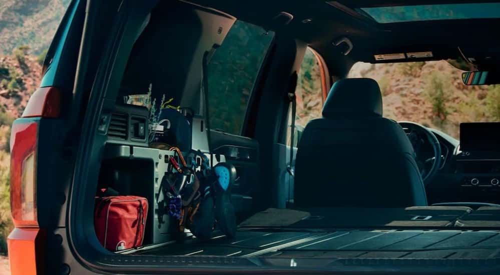 The rear cargo area is shown in a 2026 Honda Passport TrailSport Elite.