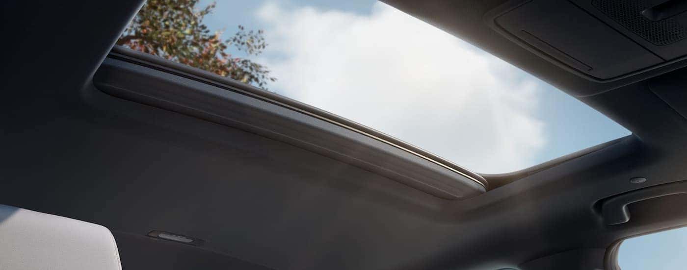 A close-up of the sunroof is shown in a 2025 Honda CR-V Sport Touring Hybrid.
