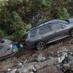A grey 2025 Honda Pilot for sale from the side while off-road.