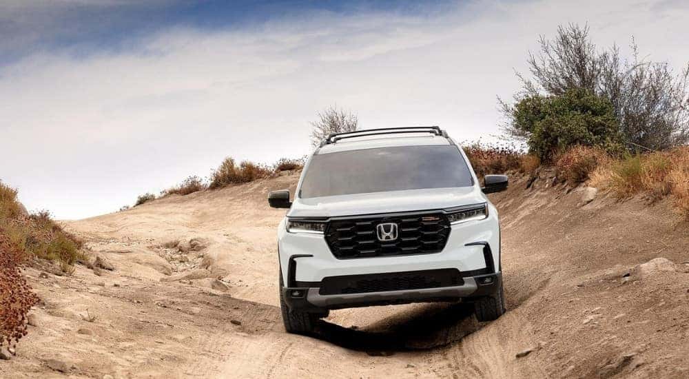 A white 2025 Honda Pilot from the front.