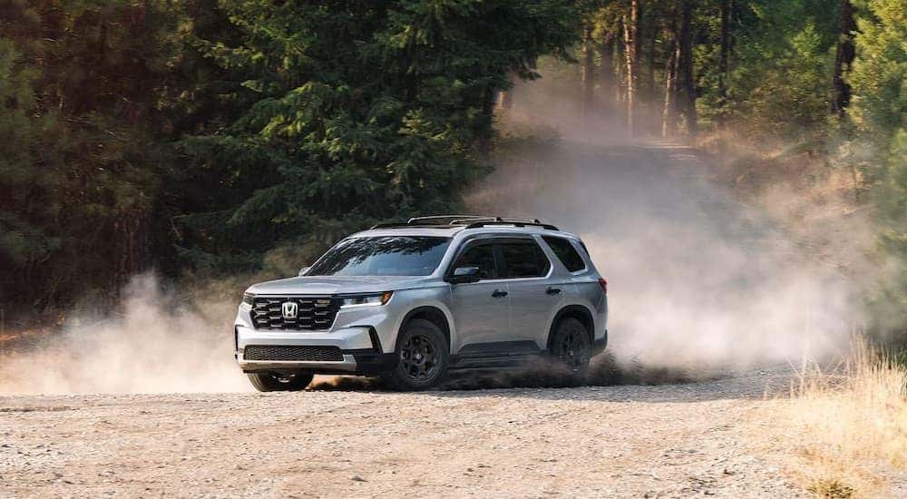 A grey 2025 Honda Pilot from the front.