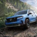 A blue 2025 Honda Pilot for sale from the front.