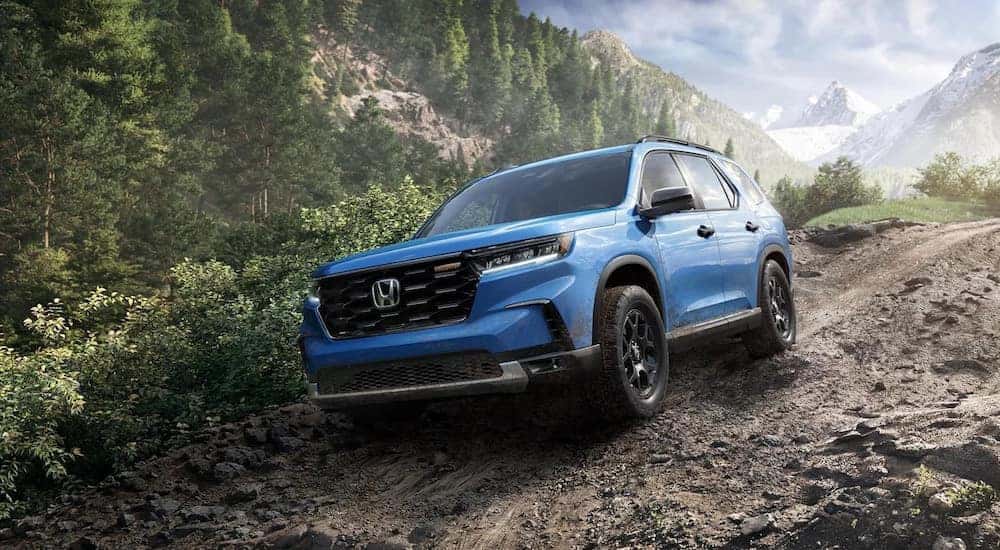 A blue 2025 Honda Pilot for sale from the front.