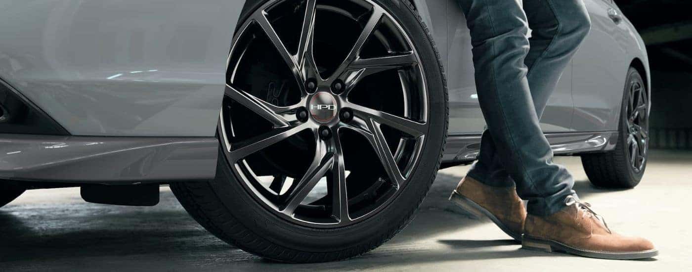 Close-up of a tire with rim on a white 2024 Honda Accord HPD