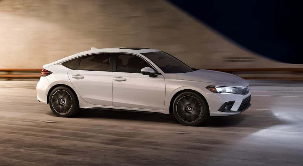White 2022 Honda Civic driving through a tunnel