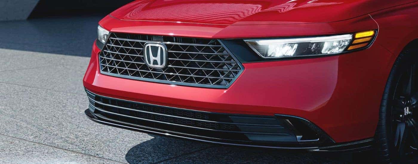 Close-up of the grille on a red 2024 Honda Accord