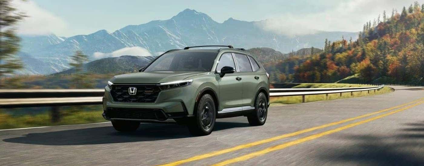 A green 2025 Honda CR-V from the front at an angle.